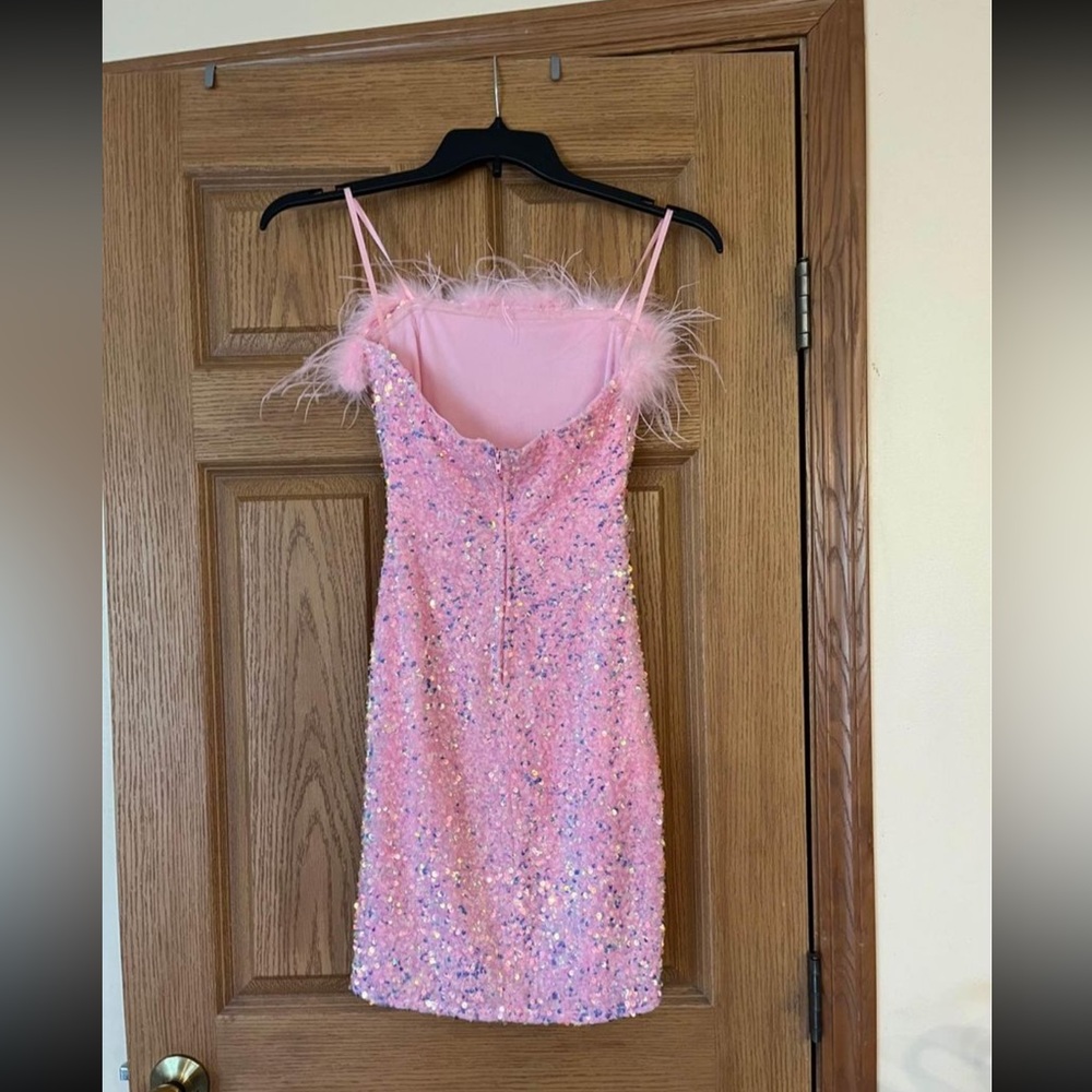 Windsor pink sequin dress with feathers.